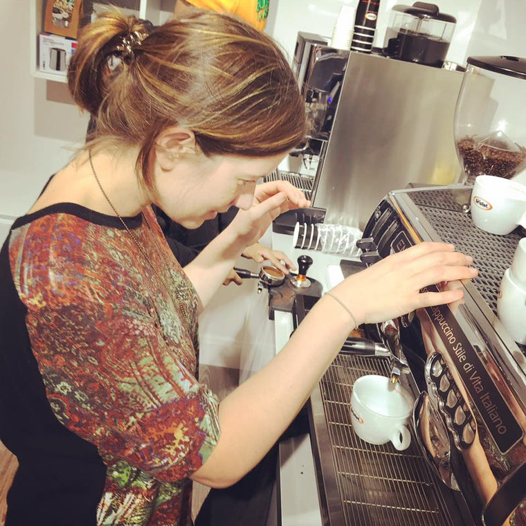 Woman being trained on Espresso Coffee Machine 
