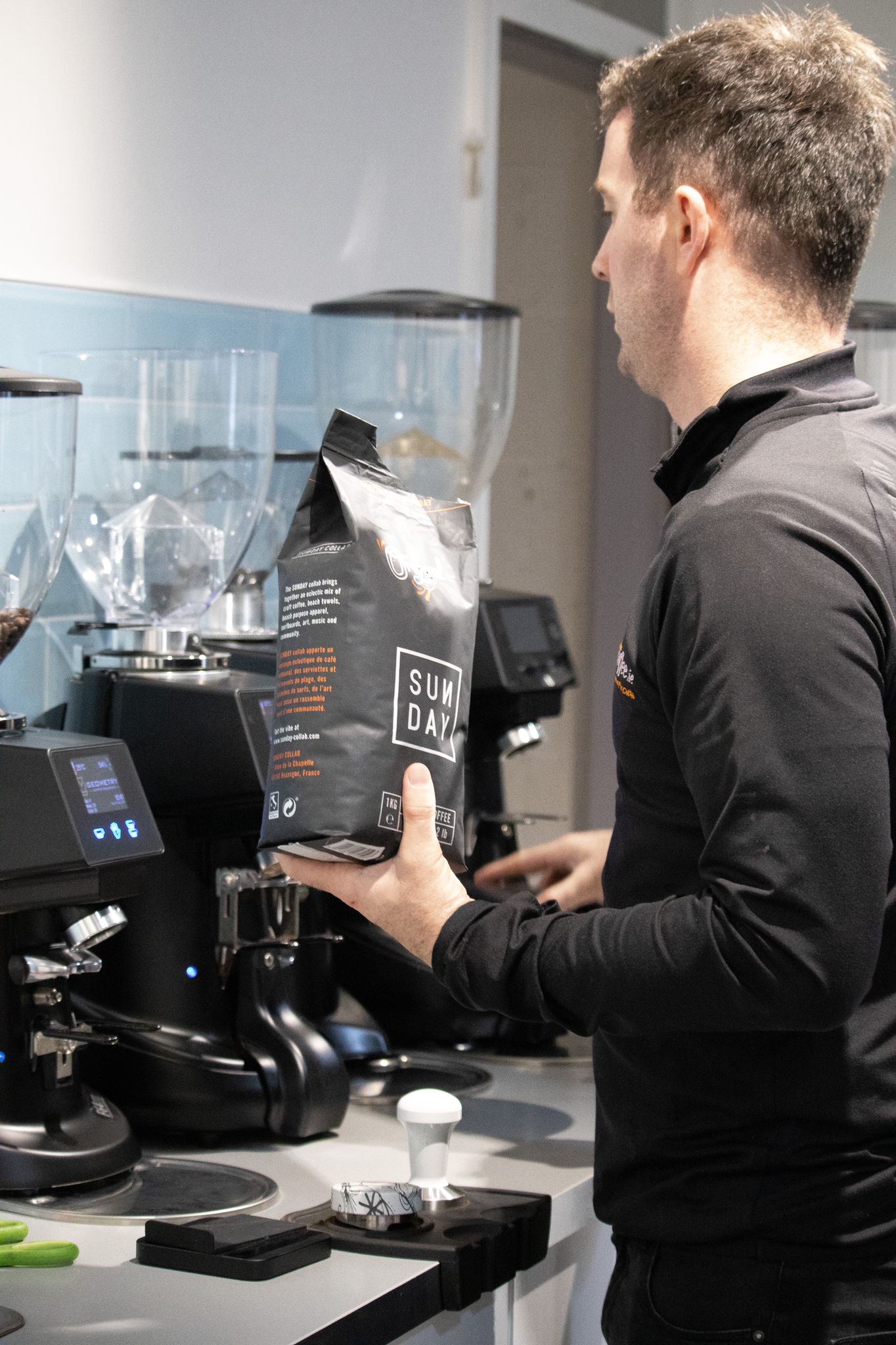 Matt ensuring our coffee grinders are topped up with latest roast from 'Sunday Coffee'.