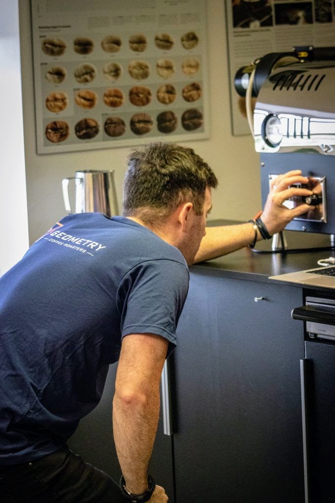 Matt checking coffee machine